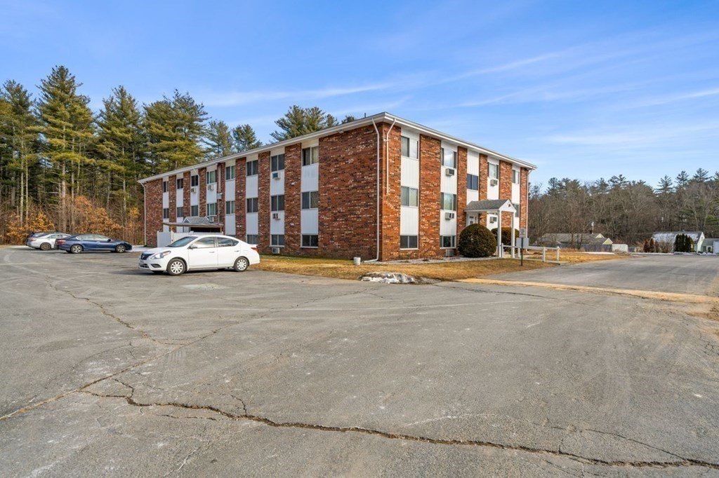 5 Turnpike Road, Unit 210 Townsend, MA 01469 - Photo 23 of 29 a car parked on the side of the road