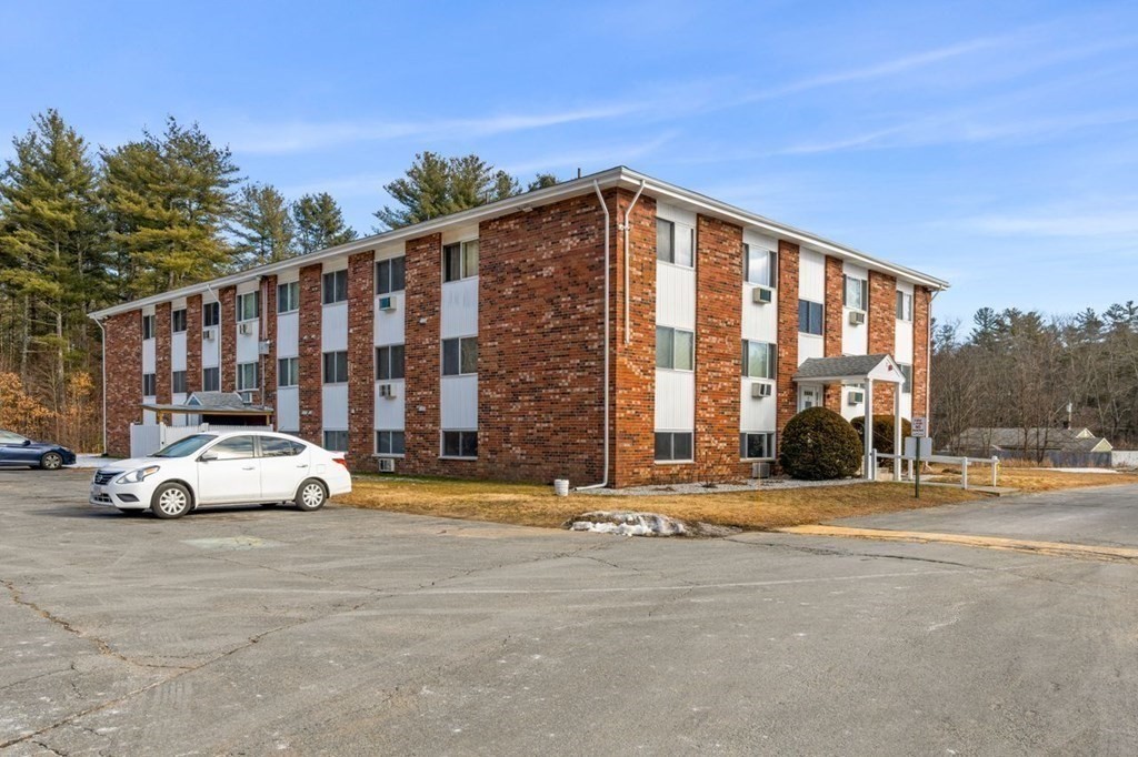 5 Turnpike Road, Unit 210 Townsend, MA 01469 - Photo 24 of 29 a view of street with parked cars