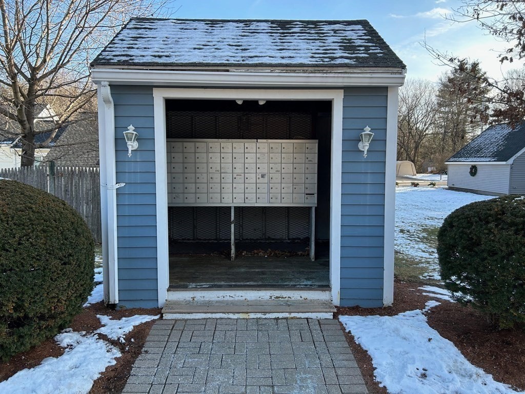 5 Turnpike Road, Unit 210 Townsend, MA 01469 - Photo 28 of 29 a stone house with yard in front of it
