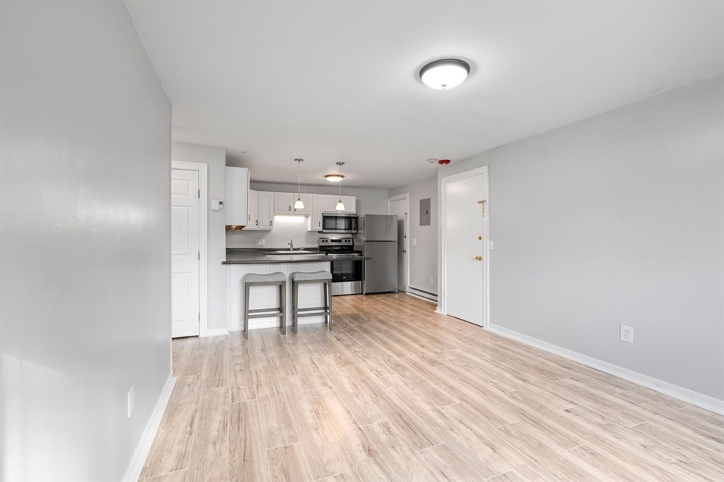 5 Turnpike Road, Unit 210 Townsend, MA 01469 - Photo 5 of 29 a view of kitchen with wooden floor