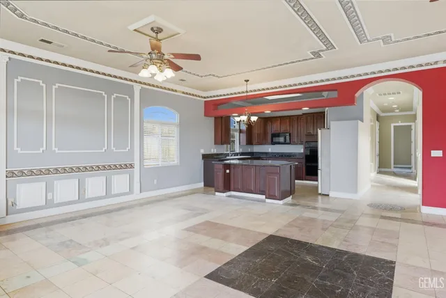 a kitchen with stainless steel appliances granite countertop a stove sink and cabinets