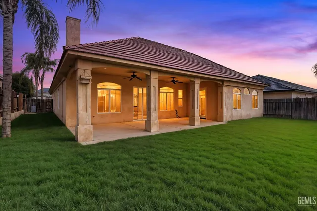 a view of house with yard