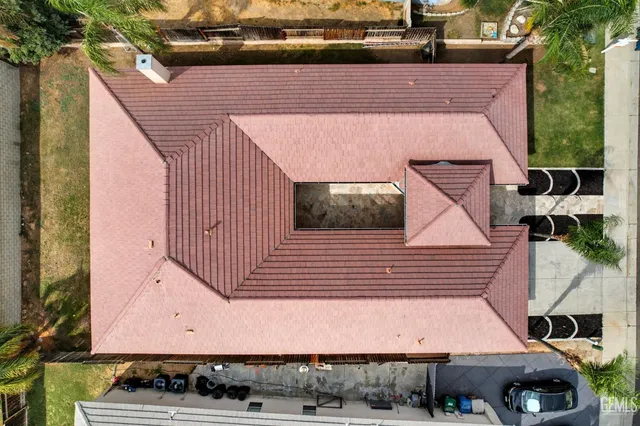 an aerial view of residential houses and city street