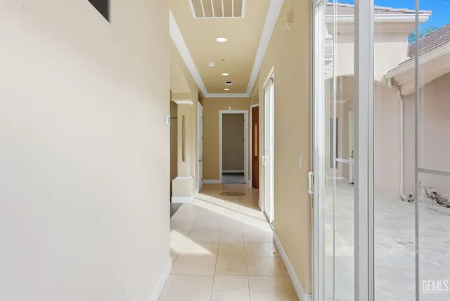 a view of an entryway with a lot of cabinet and a chandelier fan