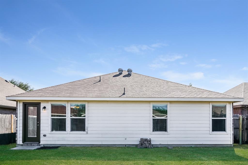 2016 Cattle Creek Road Fort Worth, TX 76134 - Photo 14 of 15 a front view of a house with a garden
