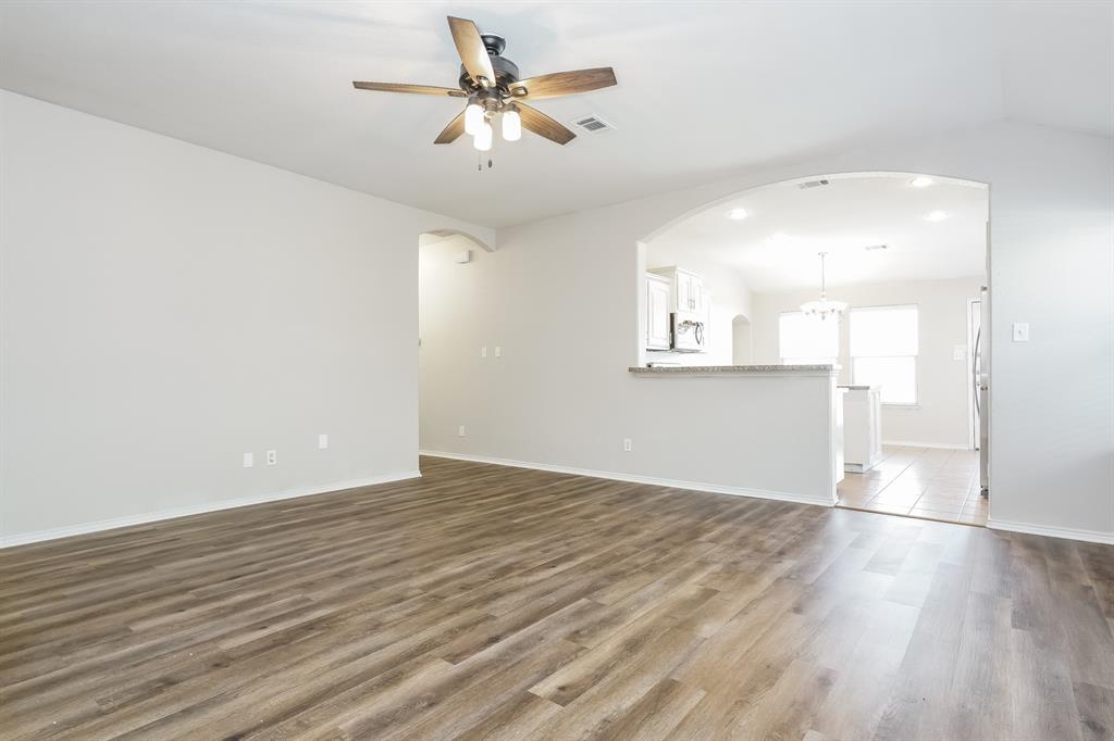 2016 Cattle Creek Road Fort Worth, TX 76134 - Photo 4 of 15 an empty room with wooden floor and windows