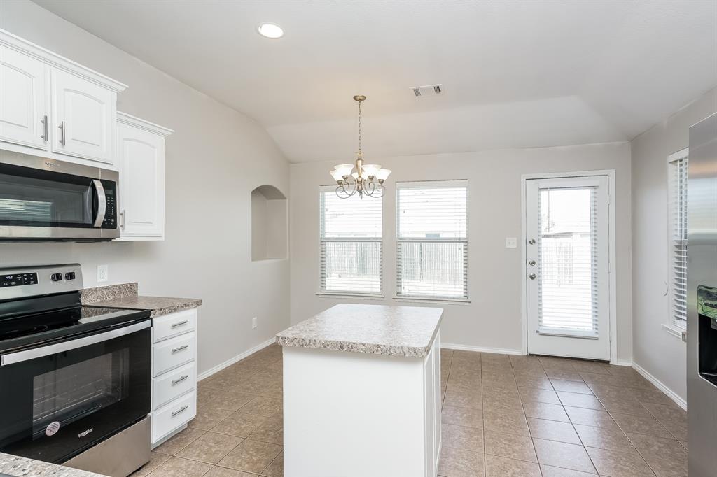 2016 Cattle Creek Road Fort Worth, TX 76134 - Photo 5 of 15 a kitchen with a stove and a microwave