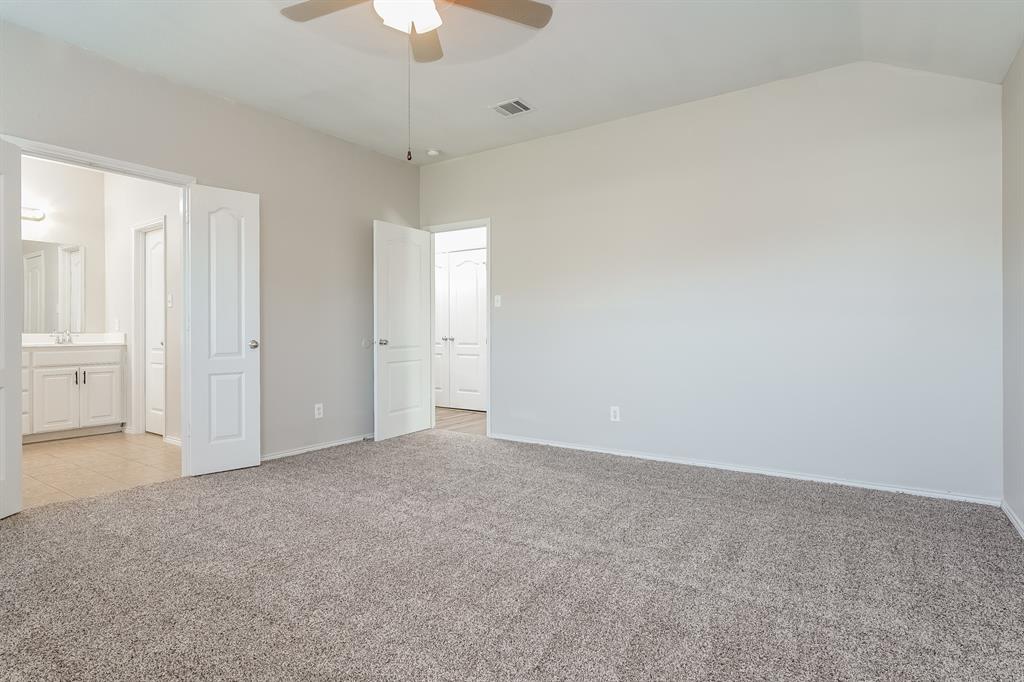 2016 Cattle Creek Road Fort Worth, TX 76134 - Photo 7 of 15 an empty room with a ceiling fan and a window