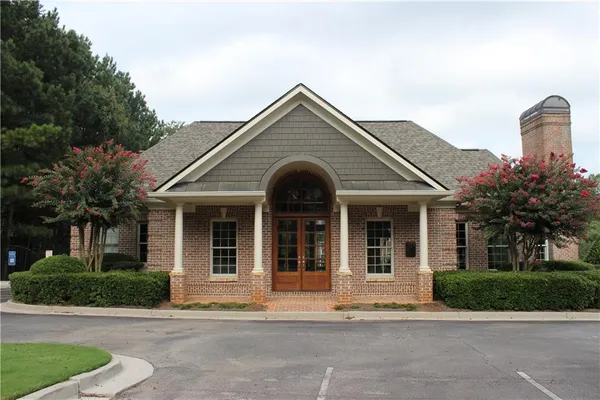 a swimming pool with outdoor seating and yard