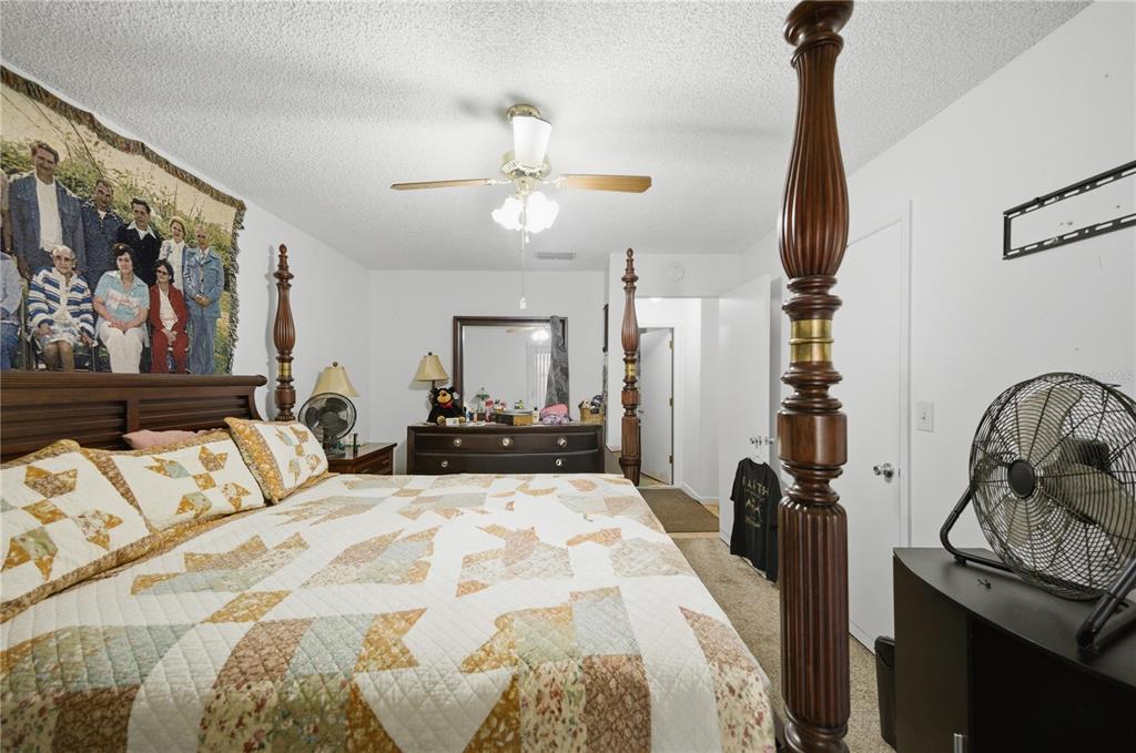 3455 Southwest 19th Street Ocala, FL 34474 - Photo 11 of 17 a bed room with a bed and a television