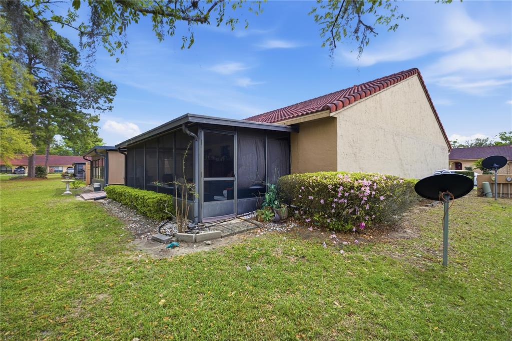 3455 Southwest 19th Street Ocala, FL 34474 - Photo 4 of 17 a view of a house with backyard and trees