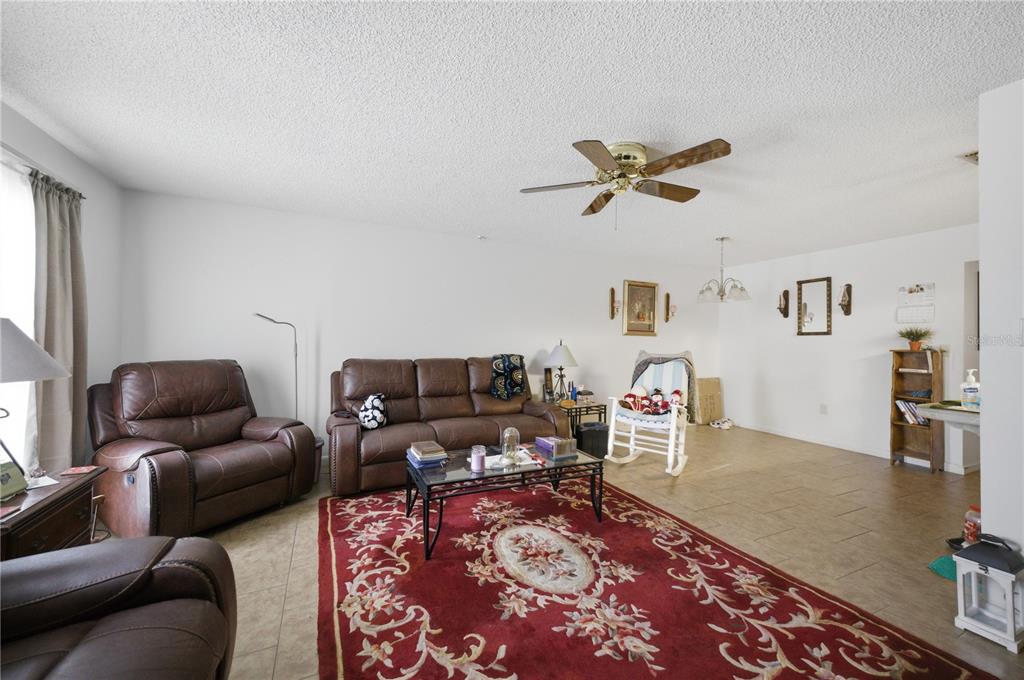 3455 Southwest 19th Street Ocala, FL 34474 - Photo 6 of 17 a living room with furniture and a rug