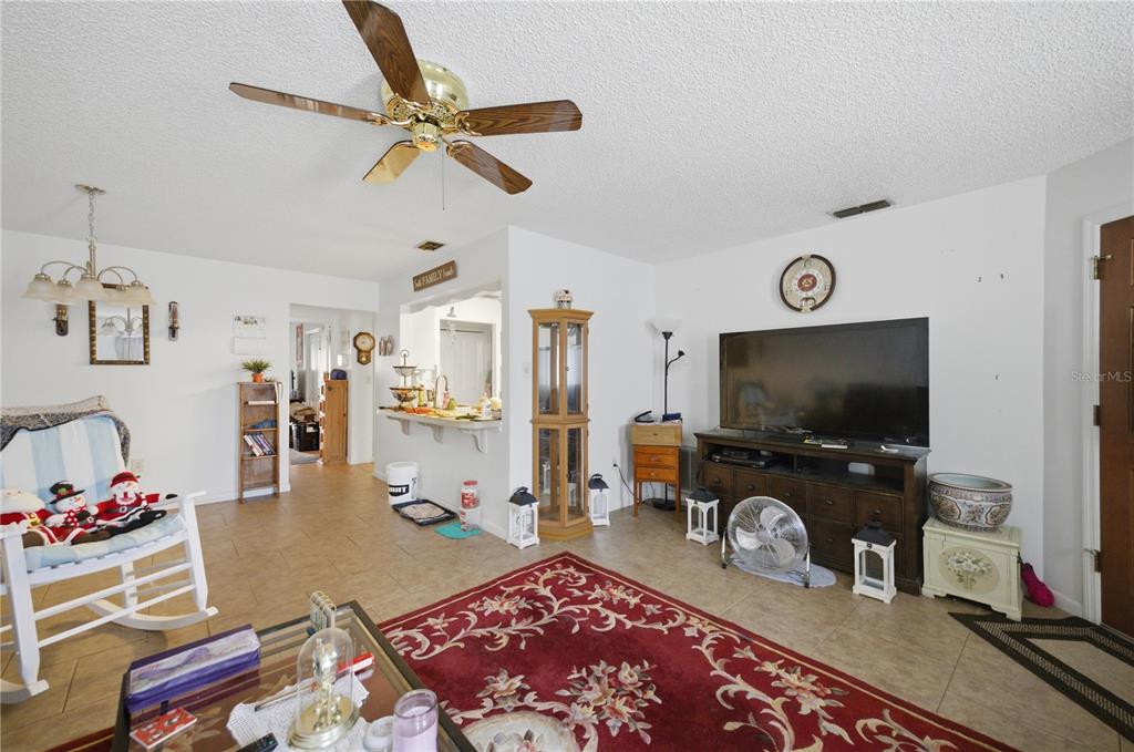 3455 Southwest 19th Street Ocala, FL 34474 - Photo 7 of 17 a living room with furniture and a flat screen tv