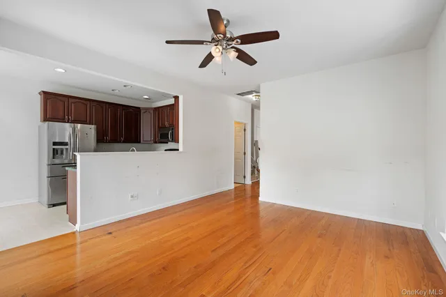 a view of a kitchen with a sink and a microwave