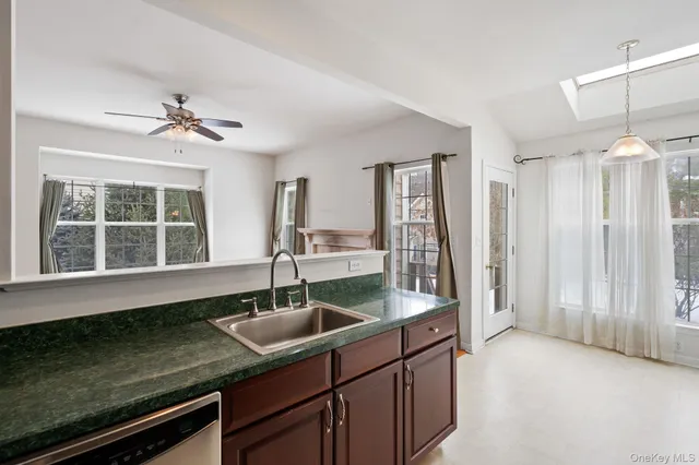 a kitchen with a sink and a window