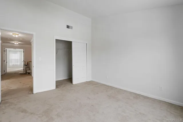 an empty room with mirror