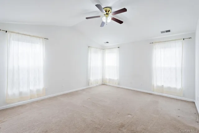 a view of a livingroom with a ceiling fan