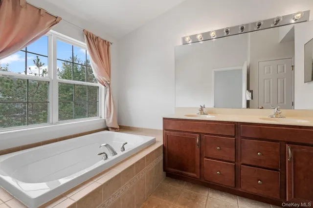 a bathroom with a bathtub and a sink