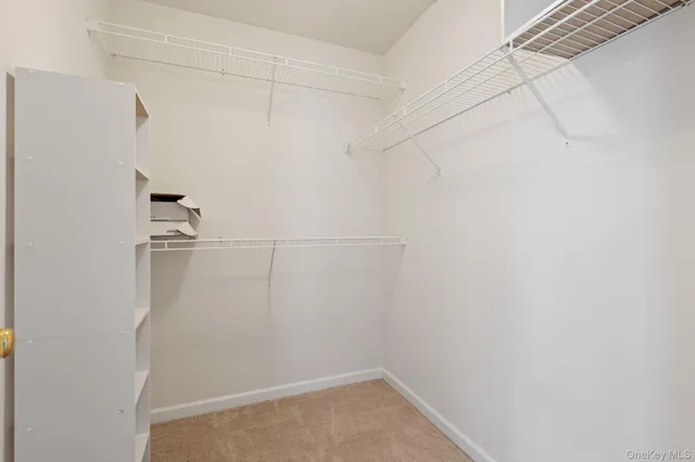 a bathroom with a sink toilet and a mirror