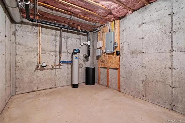 a view of an empty room with staircase