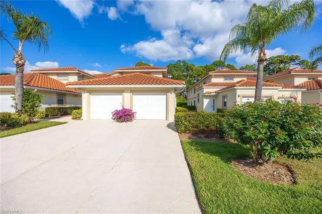 a front view of a house with yard