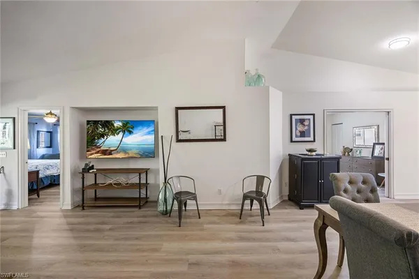 a view of a livingroom with furniture and workspace
