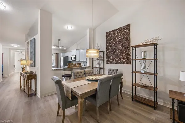 a view of a dining room with furniture and wooden floor
