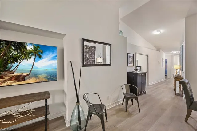 a view of a livingroom with furniture and a flat screen tv