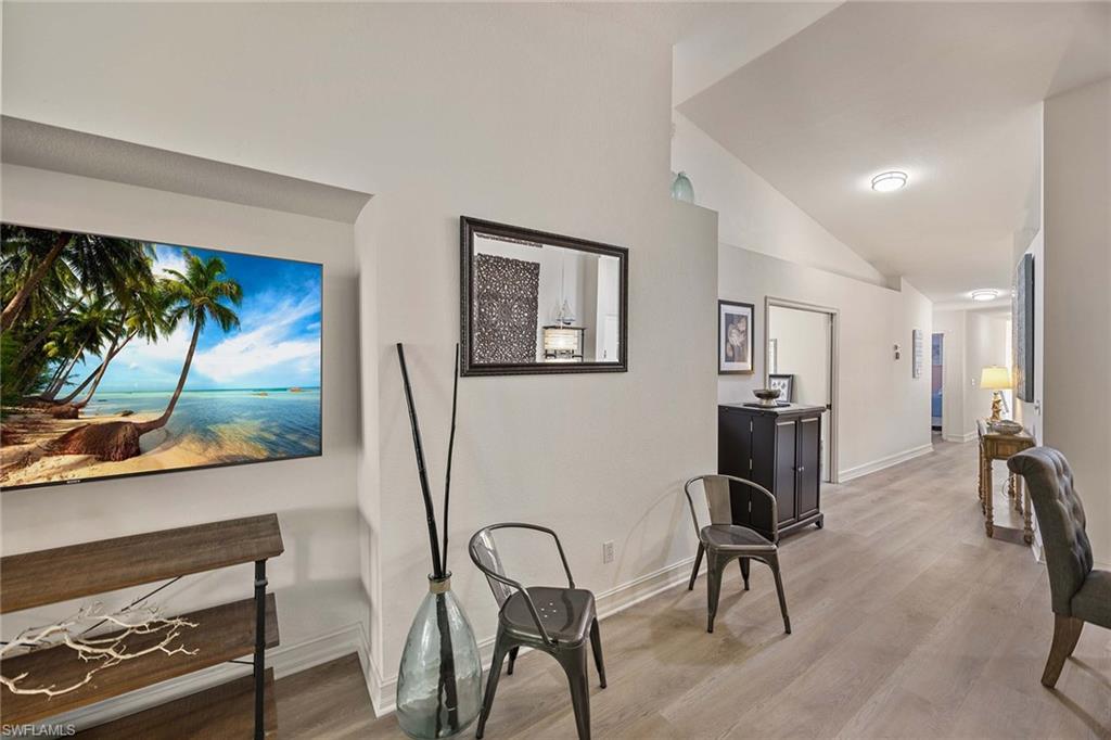 640 Luisa Lane, Unit 8044 Naples, FL 34104 - Photo 25 of 46 a view of a livingroom with furniture and a flat screen tv
