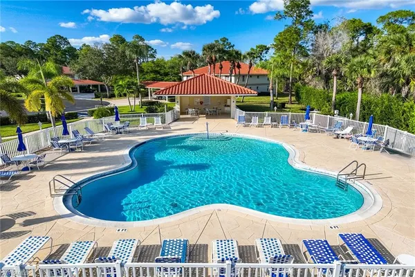 a view of a swimming pool with a patio