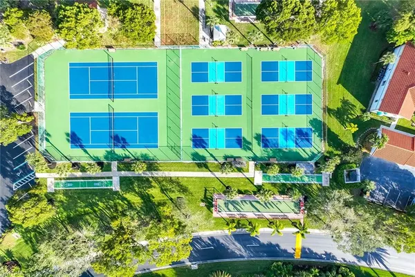 a view of backyard of house with outdoor seating