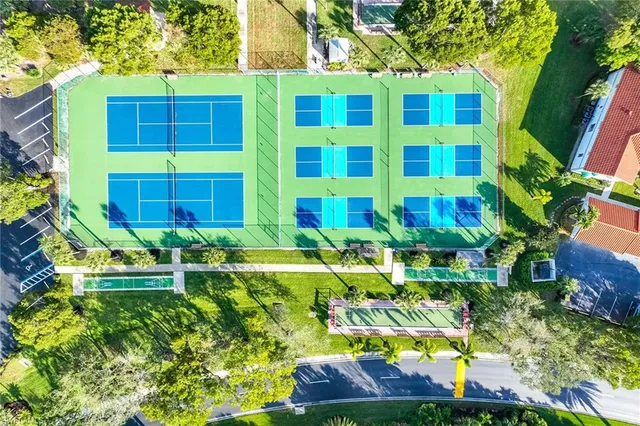 a view of backyard of house with outdoor seating