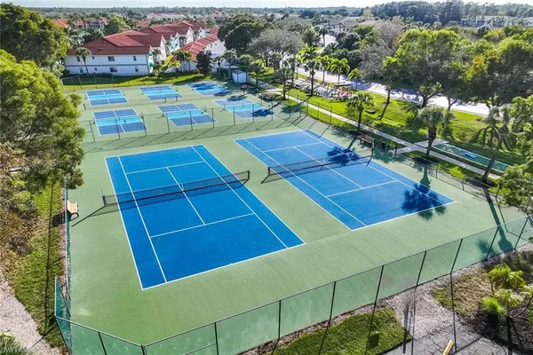 a view of a chairs and table in a backyard