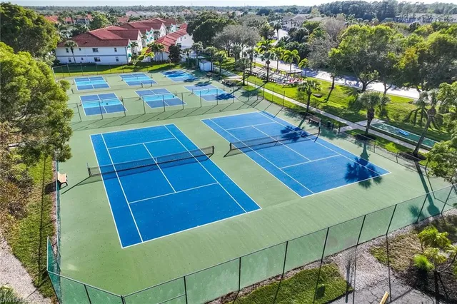 a view of a chairs and table in a backyard