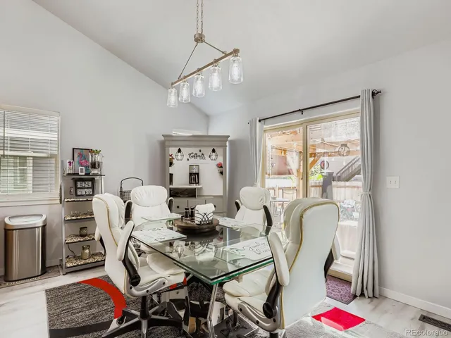 a view of a dining room with furniture window and outside view