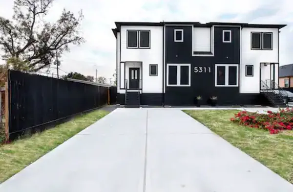 a house view with garden space