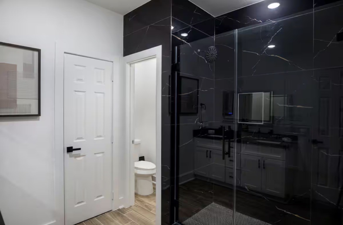 5311 Liberty Road Houston, TX 77026 - Photo 16 of 29 a bathroom with a shower and a toilet