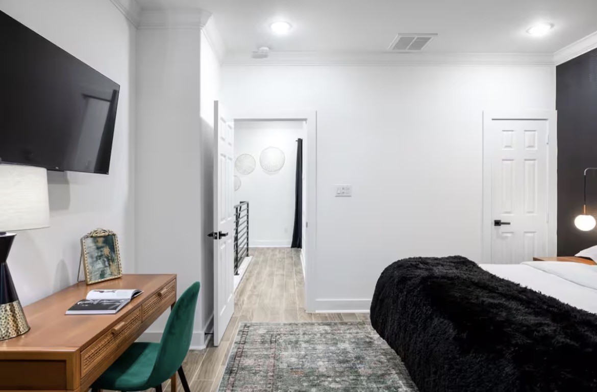 5311 Liberty Road Houston, TX 77026 - Photo 18 of 29 a bedroom with a bed and a flat screen tv