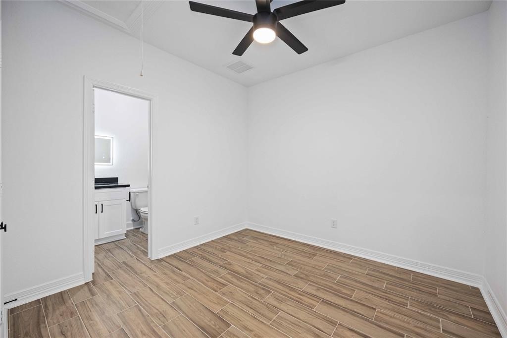 5311 Liberty Road Houston, TX 77026 - Photo 26 of 29 a view of empty room with wooden floor and window