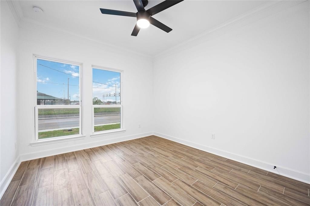 5311 Liberty Road Houston, TX 77026 - Photo 27 of 29 a view of a room with wooden floor and window