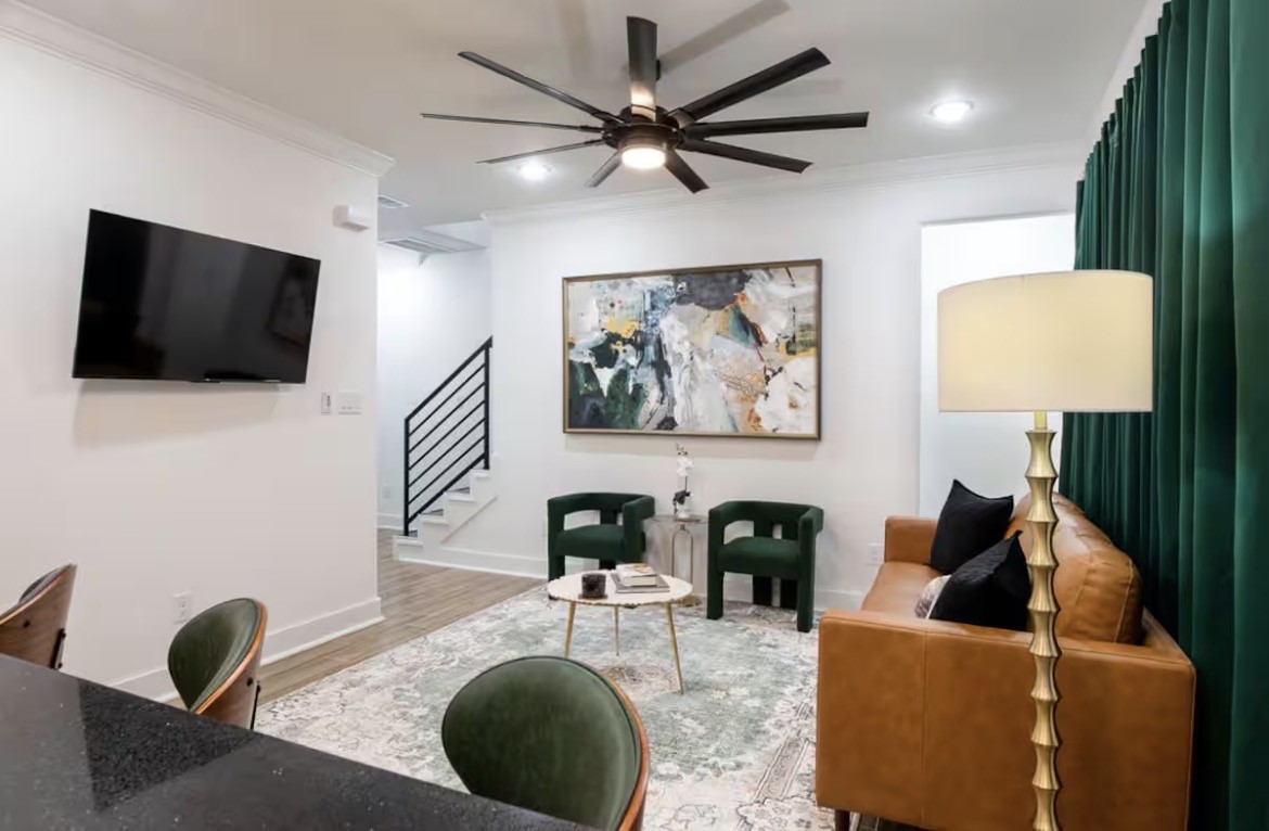 5311 Liberty Road Houston, TX 77026 - Photo 4 of 29 a living room with furniture and a flat screen tv