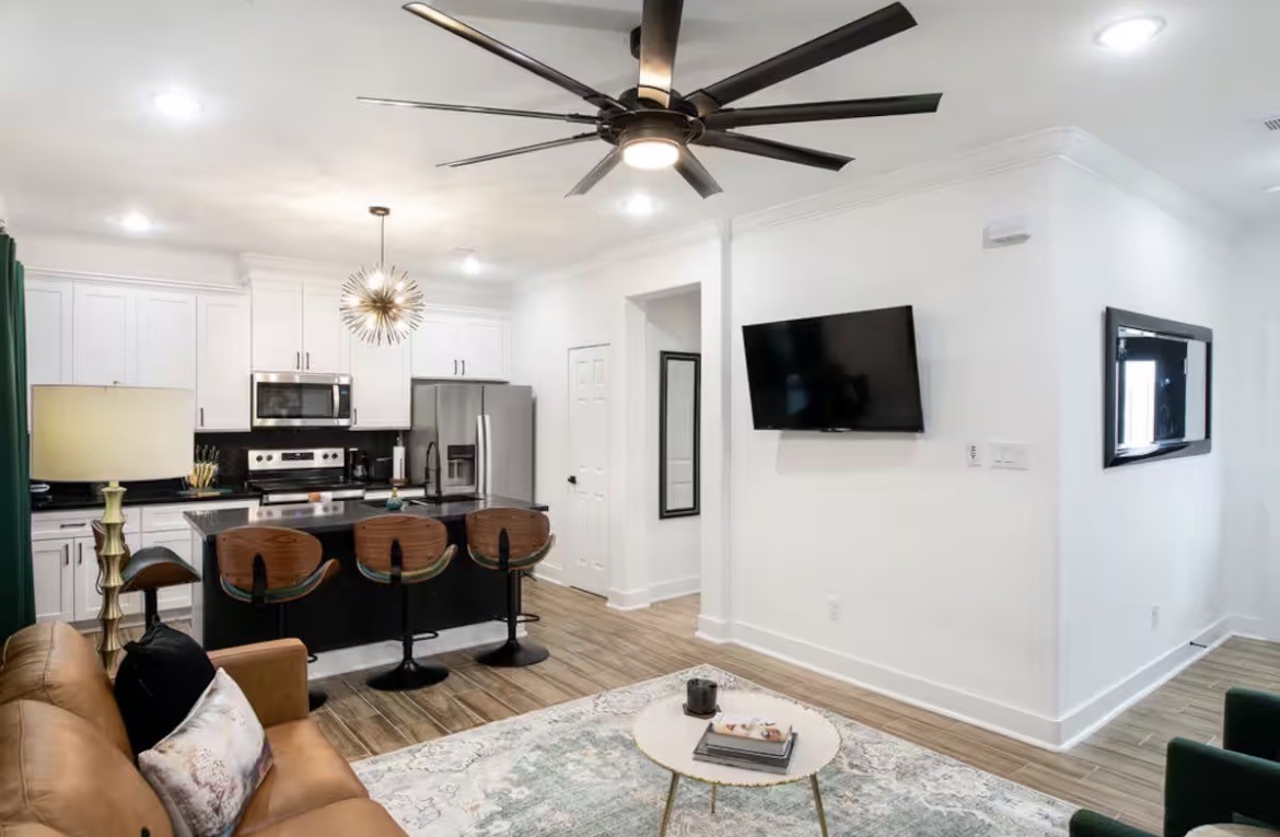 5311 Liberty Road Houston, TX 77026 - Photo 6 of 29 a living room with furniture and a flat screen tv