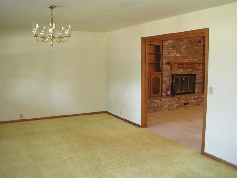 1201 16th Street Ralls, TX 79357 - Photo 3 of 10 a view of a livingroom with a chandelier