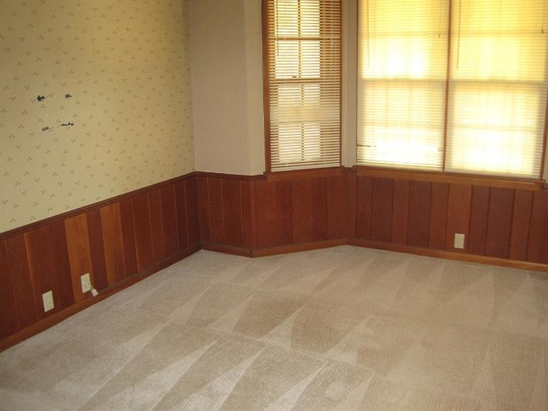 1201 16th Street Ralls, TX 79357 - Photo 8 of 10 a view of an empty room with a window