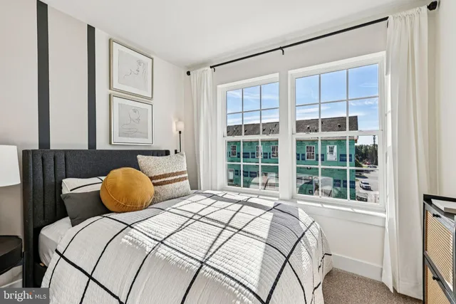 a bedroom with a bed and window