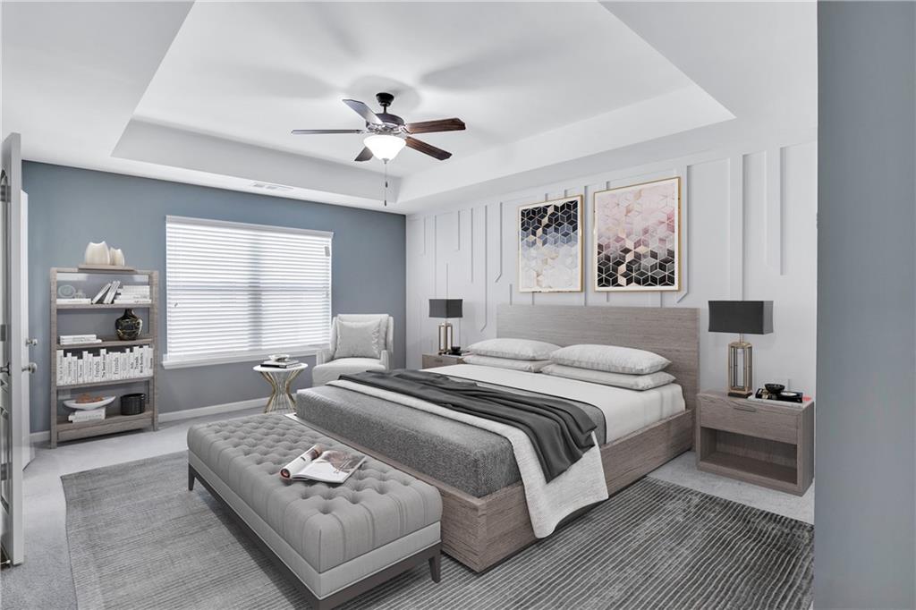 330 Avalon Square Fairburn, GA 30213 - Photo 21 of 52 a spacious bedroom with a bed a couch and a window