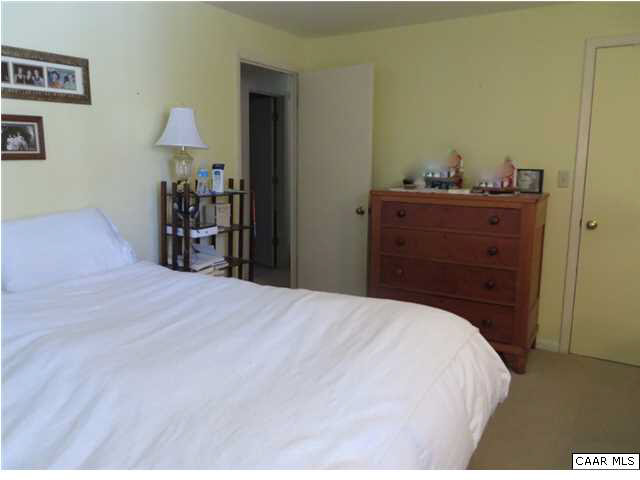 1228 Chatham Ridge Charlottesville, VA 22901 - Photo 7 of 20 a bedroom with a bed and a mirror