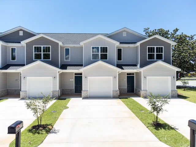 a front view of a house with a garage
