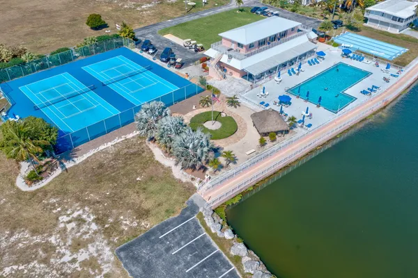 a view of a swimming pool with an outdoor space and seating area