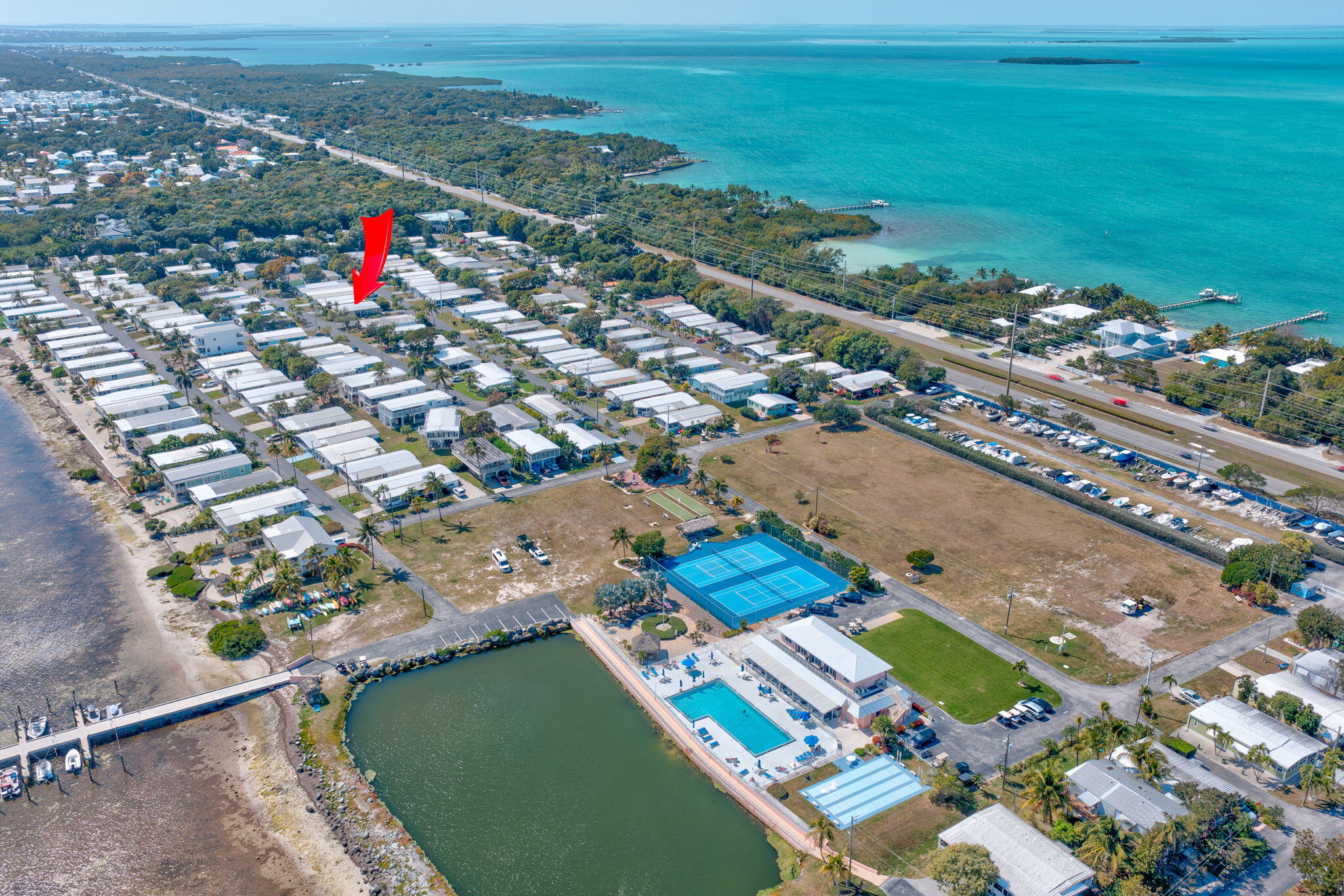 902 South Ruby Drive Key Largo, FL 33037 - Photo 14 of 44 an aerial view of a city with lots of residential buildings ocean and mountain view in back